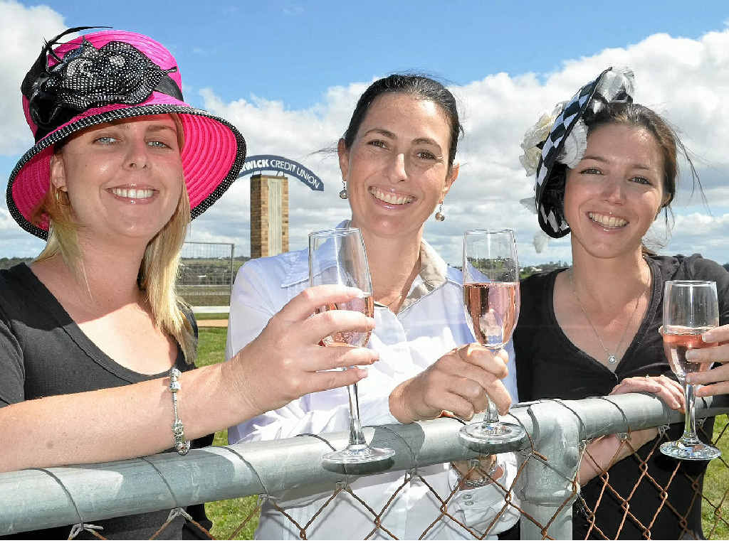 CHEERS TO THAT: Helena Penny, Angela Mosedale and Melanie Fraser at a race meet at Allman Park.